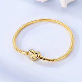Sterling silver heart charm bracelet with gold plated finish