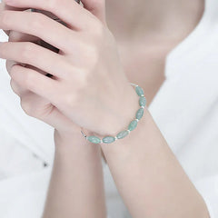 Adjustable sterling silver bracelet with natural green jade