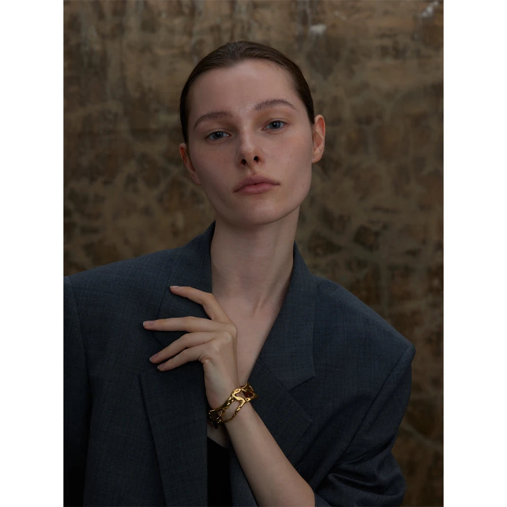 Gold geometric cuff bracelet in 18K PVD stainless steel
