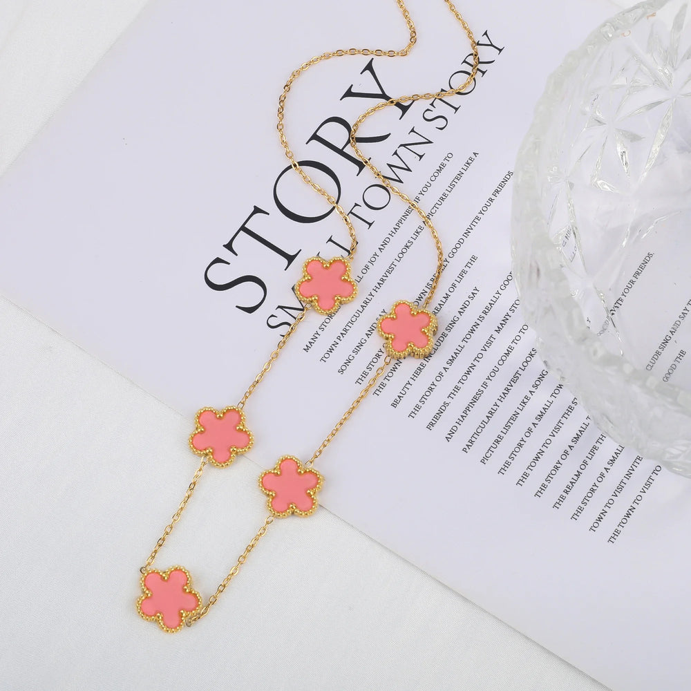 Stainless steel clover bracelet with four leaf charm design
