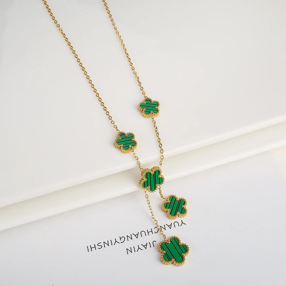 Stainless steel clover bracelet with four leaf charm design
