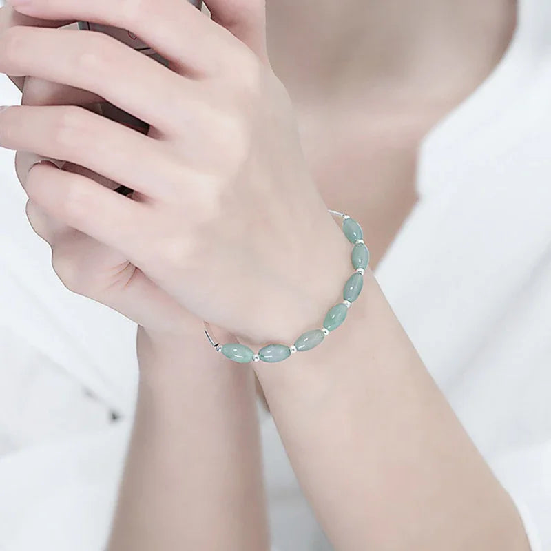Adjustable sterling silver bracelet with natural green jade
